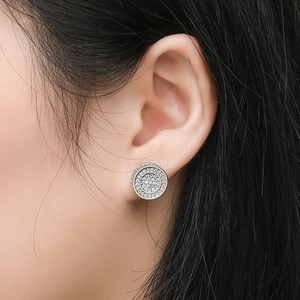 Detailed close-up of S925 silver round stud earring with micro-pave zircons worn on ear