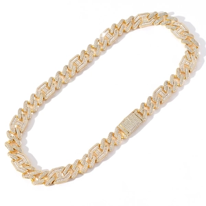 Macro view of 15mm gold Cuban link chain with paved rhinestones and secure clasp