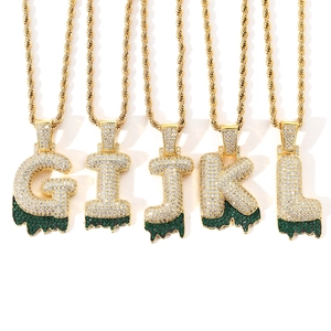 Detailed view of hip hop bubble letters G to L with green lava drips and zircons