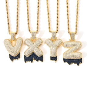 Detail of hip hop bubble letters V X Y Z with blue lava drip and cubic zirconia