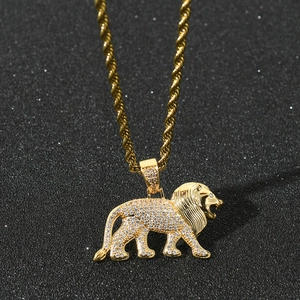 Macro shot of 18K gold plated lion pendant with micro-paved cubic zirconia stones