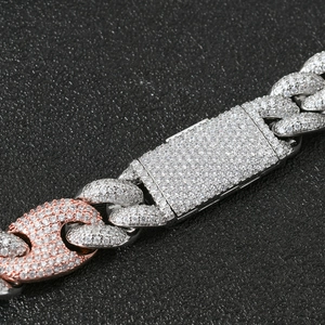 Macro view of 20mm two-tone Miami Cuban chain with micro-pave cubic zirconia settings