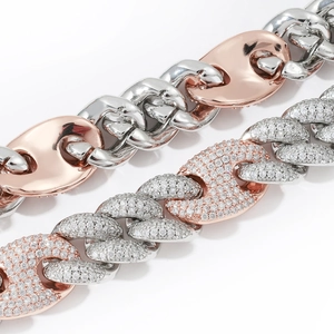 Macro shot of two-tone coffee bean link chain with shimmering micro-pave zircon crystals