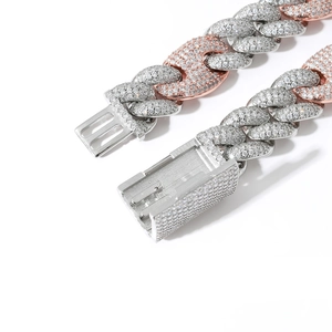 Macro shot of iced out two-tone cuban chain with micro-pave zircons and box clasp
