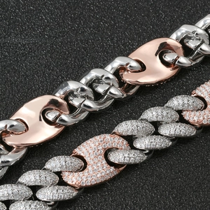 Macro view of 20mm two-tone pig nose Cuban chain necklace with micro-paved zircons