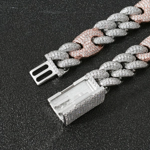 Close-up of dual-tone hip-hop cuban link chain with paved zircon stones and box clasp