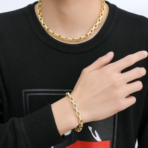 Hip hop gold rectangle link chain set with sparkling cubic zirconia on male model