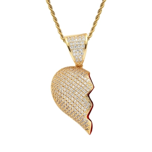 Detail of hip-hop broken heart pendant with micro-paved cubic zirconia and red enamel finish