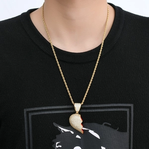 Close-up of hip hop gold rope chain with micro-paved zircon broken heart pendant