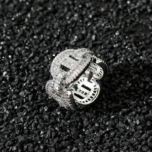 Macro shot of silver hip hop ring with baguette cut and pavé set cubic zirconia