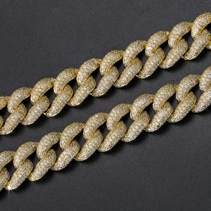 Close-up of 12mm iced out Cuban link chain featuring gold plating and cubic zirconia