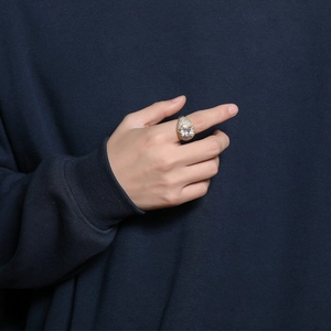 Hip hop gold plated ring for men featuring a large round zircon and iced out paved stones
