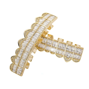 Iced out gold hip hop grillz set with baguette cut cubic zirconia stones for teeth
