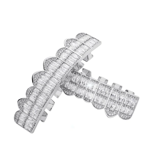 Macro shot of silver hip-hop grillz set with clear baguette-cut cubic zirconia stones
