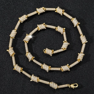 Golden iced-out barbed wire Cuban link necklace with white cubic zirconia crystals
