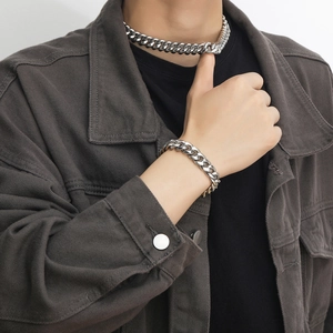 Silver stainless steel Cuban link necklace and bracelet set shown on male model