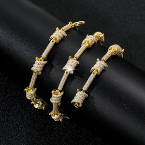 Macro shot of gold barbed wire chain with full cubic zirconia pave in hip hop style