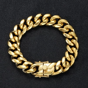 Detailed close-up of gold stainless steel Cuban link chain with a secure double safety clasp