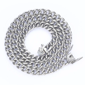 Macro shot of polished silver Cuban link chain showing secure lobster clasp and metal texture