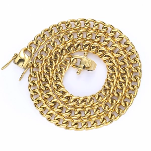 Detailed macro view of gold-plated stainless steel Cuban link chain with secure box clasp