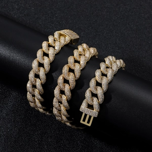 Close-up of 15mm golden Cuban link chain with micro-paved sparkling cubic zirconia
