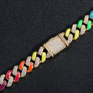 Macro detail of 12mm Cuban link chain featuring colorful enamel and micro-pave zircons