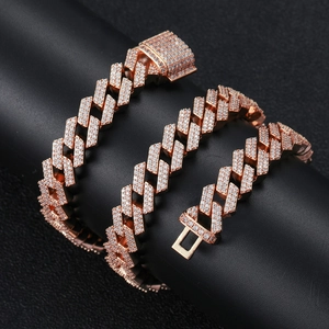 Close-up of 12mm rose gold Cuban link necklace with double row iced out zircons