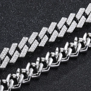 Macro detail of 12mm silver Cuban link bracelet with double row white zircon stones