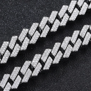 Macro view of 12mm silver rhinstone cuban link chain with pavé micro-set cubic zirconia