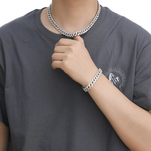 Detail of 12mm 18K gold plated Cuban link necklace with sparkling double row zircon stones