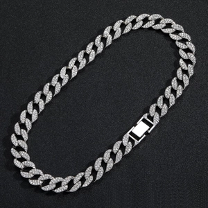Detailed macro view of 15mm silver Cuban link chain with paved diamonds and secure box clasp