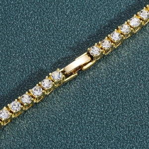 Classic golden tennis bracelet with round cubic zirconia and secure fold-over clasp