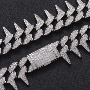 Hip-hop spiked Cuban chain necklace with silver-tone micro-paved zircons on black background