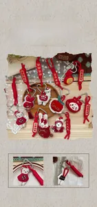 Close-up of festive plush keychains featuring traditional red embroidery and animal shapes