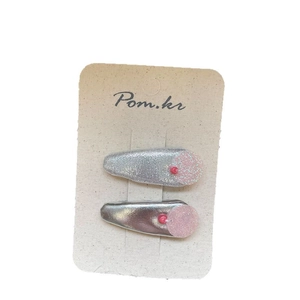 Sparkly pink flower hair clips with silver base for girls on a display card
