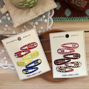 Korean style floral BB hair clips set with cute rabbit patterns on a card display