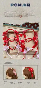 Detailoverzicht Chinese haarbandset voor kinderen met rode strikken, kwastjes en parels