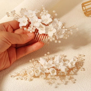 Handmade bridal hair comb set with white flowers and pearls for wedding hairstyles