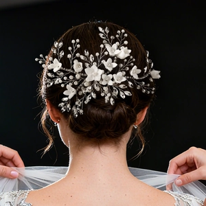 Detail of handmade bridal hair comb with pearls and rhinestones on elegant hair bun
