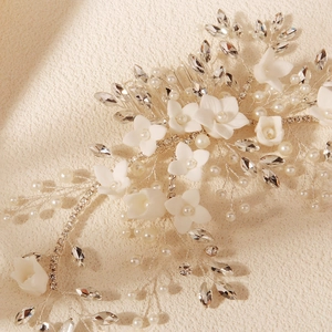 Handmade bridal hair comb with ceramic flowers, pearls, and crystals for weddings