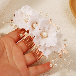 Elegant bridal hair comb with handmade white fabric flowers and delicate pearl beads