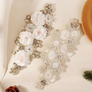 Exquisite white fabric flower brooch with heavy crystal rhinestones and lace back