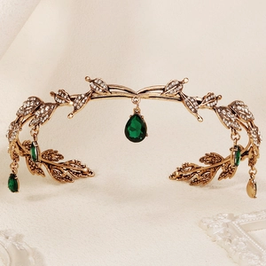 Vintage gold leaf crown with emerald green teardrop pendants and sparkling rhinestones