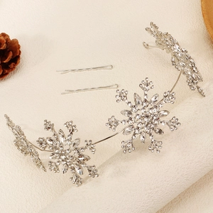 Close-up of snowflake bridal headband with sparkling rhinestones and matching hair clips