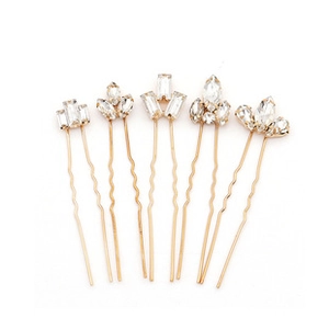 Detail of 5-piece gold U-shaped hair pins with crystal flower rhinestones set