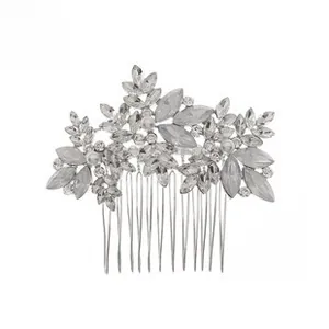Detailed macro view of silver alloy bridal hair comb with rhinestones and opal stones