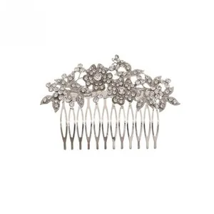 Detailed view of silver flower hair comb with intricate crystal leaf patterns