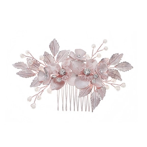 Detail of handmade bridal hair comb with pink flowers, pearls and crystal rhinestones