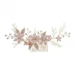 Detailed macro of pink frosted floral hair comb with rhinestones and golden pearls