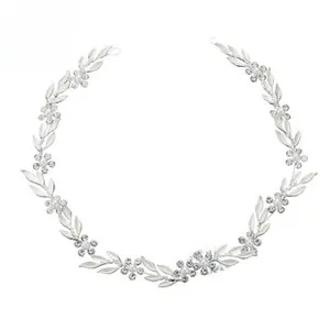 Detailed close-up of handmade bridal headband with silver flowers and delicate pearls